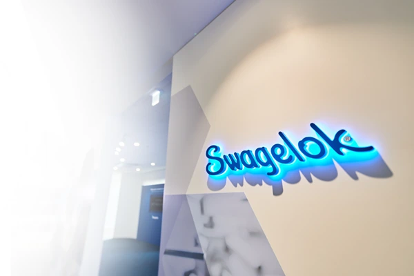 Slide-swagelok facility sign