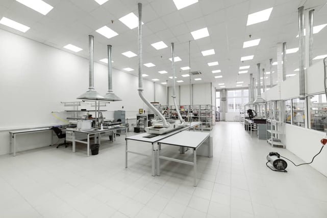 A picture of an industrial clean room with industrial process piping, tubing, and components for semiconductor manufacturing