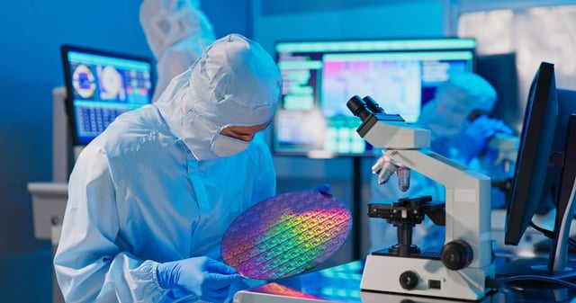 A technician checking a semiconductor inside manufacturing plant