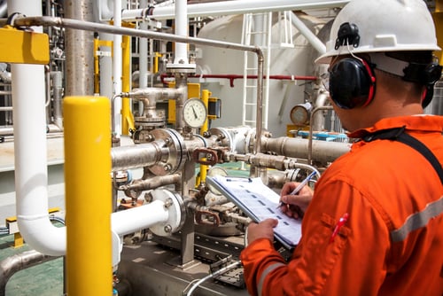 A technician performing preventive maintenance to ensure API Plan 72 protection.